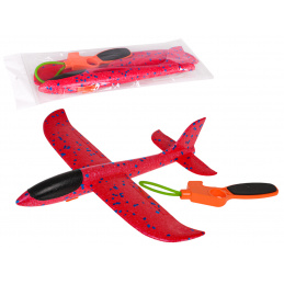 Polistirenski avion s ručnim katapultom crvene boje